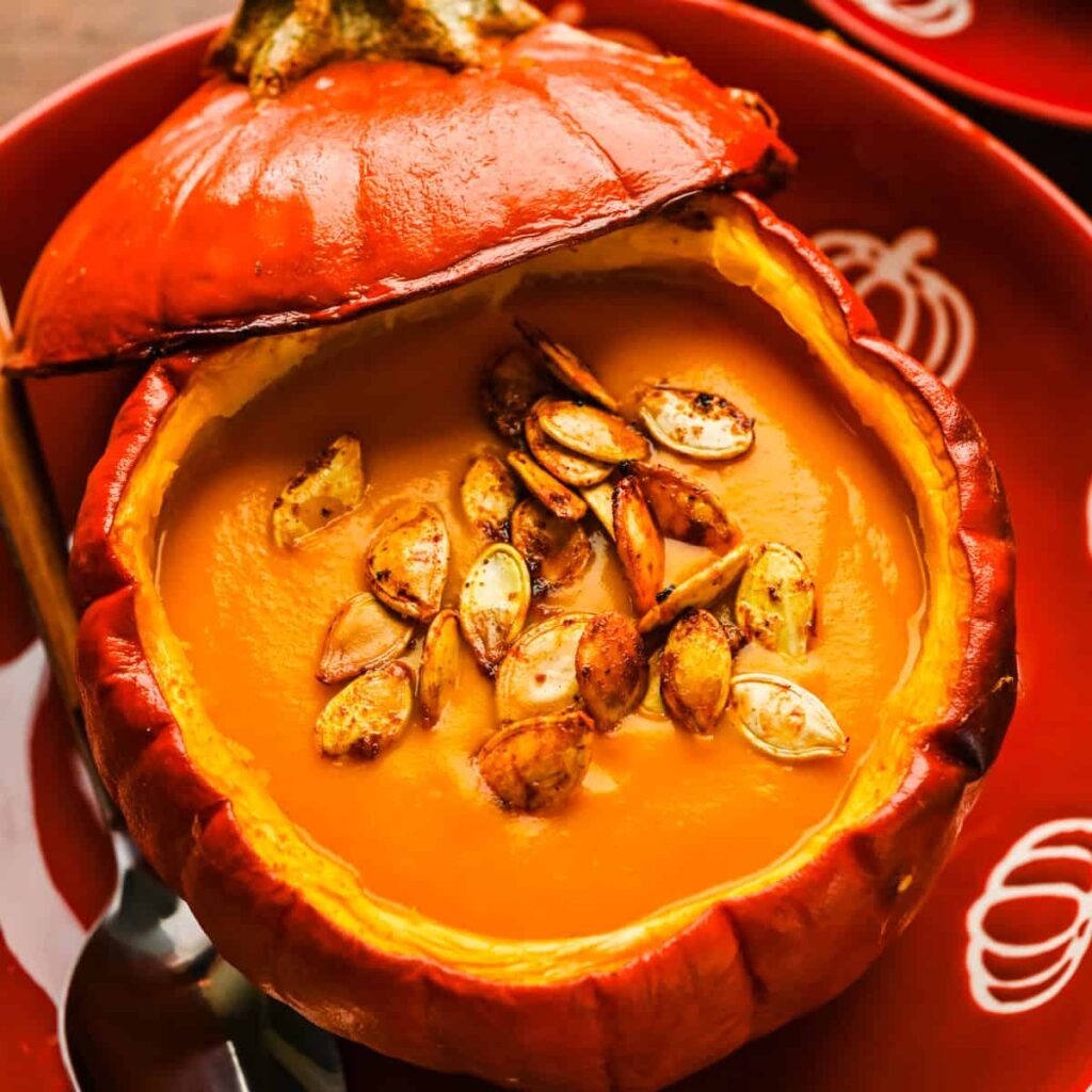 Overhead view of sheet pan soup in a pumpkin bowl.